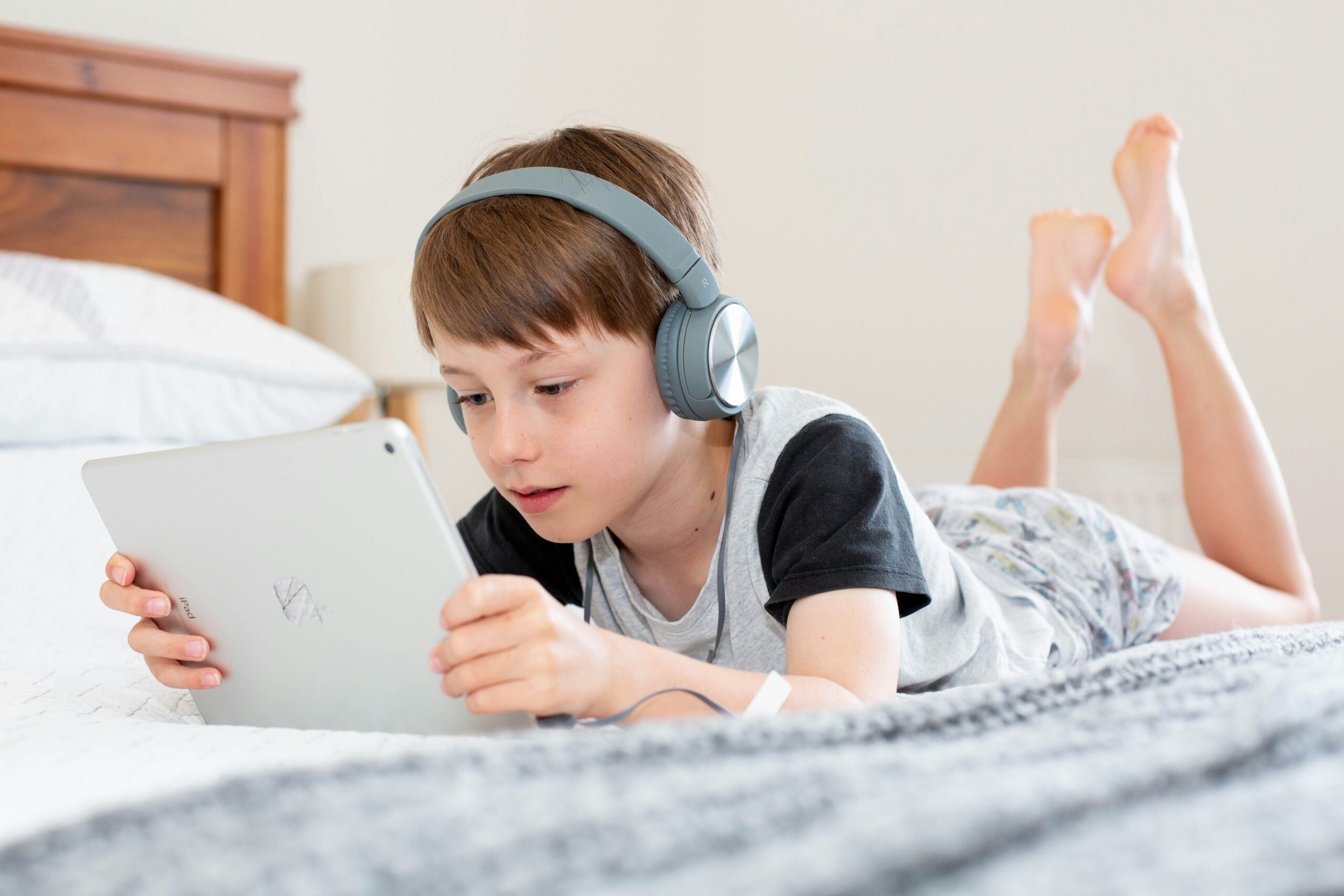 Kid playing with his iPad